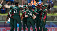 (AP Photo/Lynne Sladky) : Bangladesh's Rishad Hossain, second left, celebrates with teammates after the dismissal of India's Rishabh Pant during the ICC Men's T20 World Cup cricket match between India and Bangladesh at Sir Vivian Richards Stadium in North Sound, Antigua and Barbuda, Saturday, June 22, 2024. 
